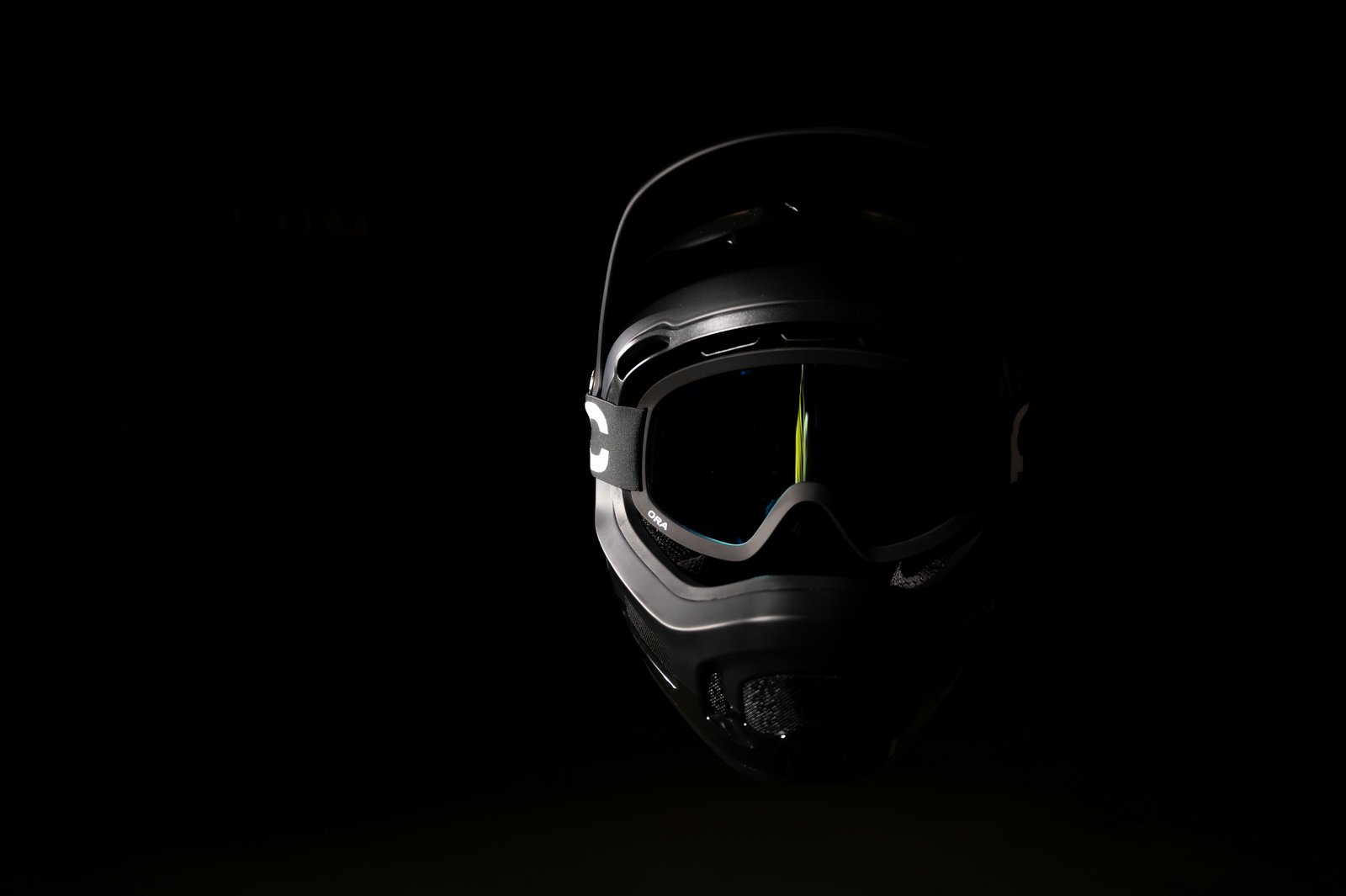 a helmet and goggles are shown in the dark